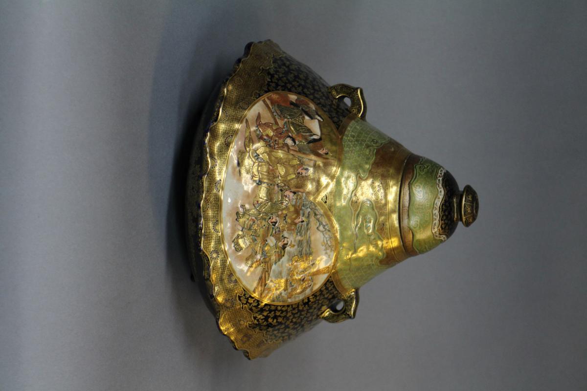 A large Japanese 19th century mount Fuji shaped Satsuma vase and cover