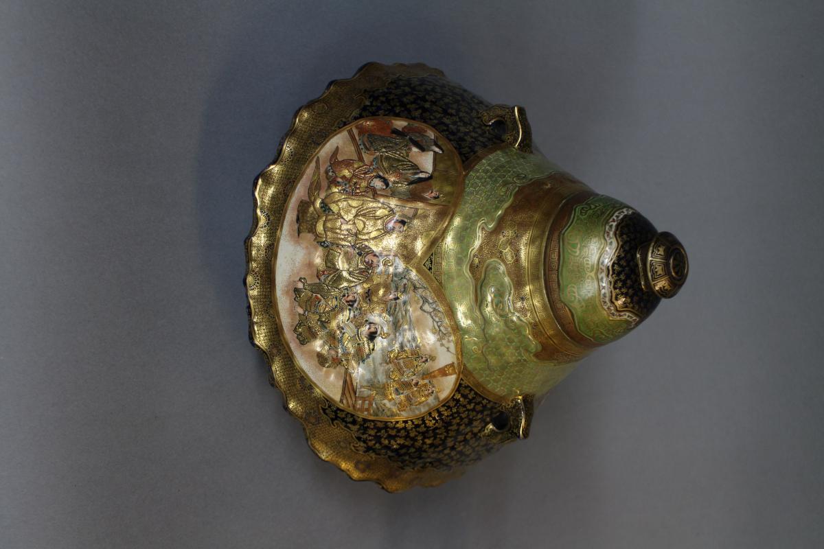 A large Japanese 19th century mount Fuji shaped Satsuma vase and cover