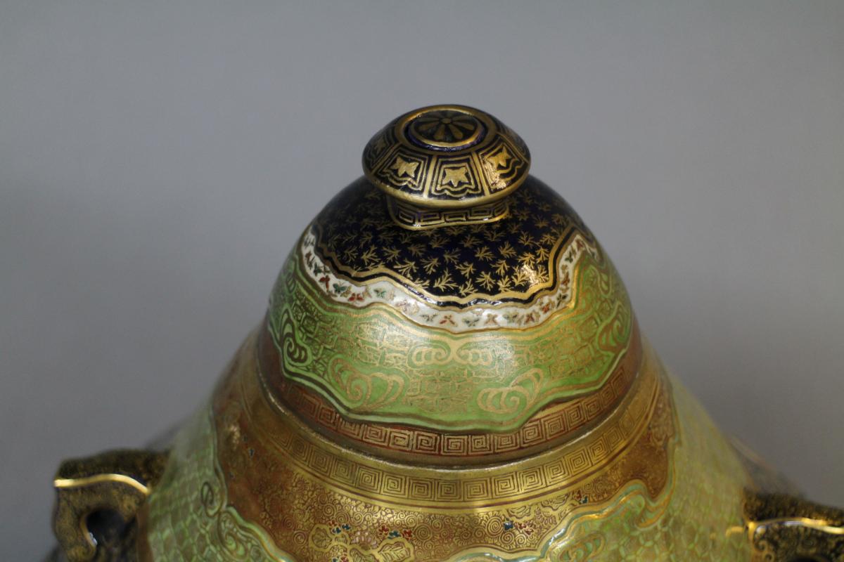 A large Japanese 19th century mount Fuji shaped Satsuma vase and cover