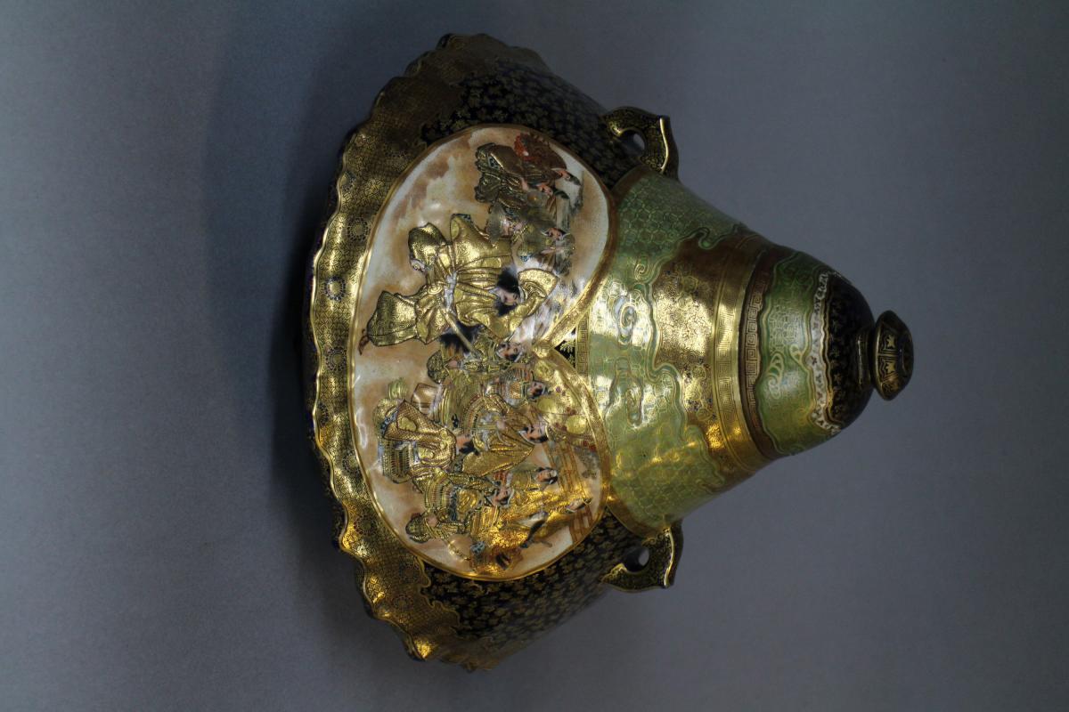 A large Japanese 19th century mount Fuji shaped Satsuma vase and cover