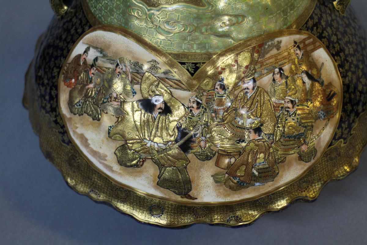 A large Japanese 19th century mount Fuji shaped Satsuma vase and cover