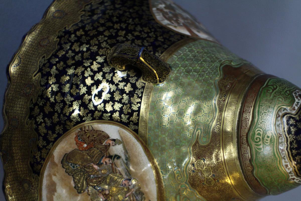 A large Japanese 19th century mount Fuji shaped Satsuma vase and cover