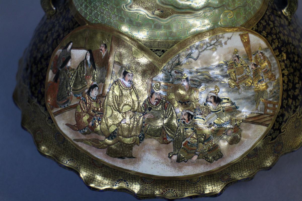 A large Japanese 19th century mount Fuji shaped Satsuma vase and cover