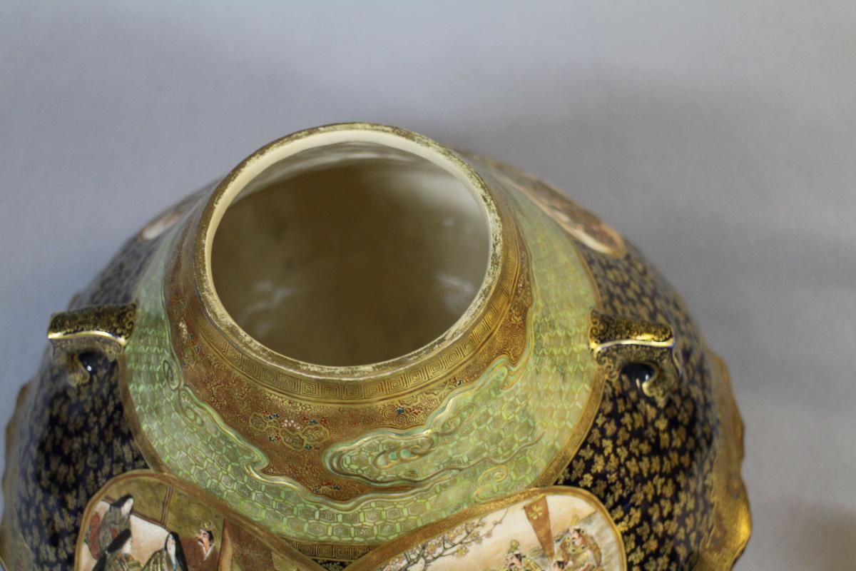 A large Japanese 19th century mount Fuji shaped Satsuma vase and cover