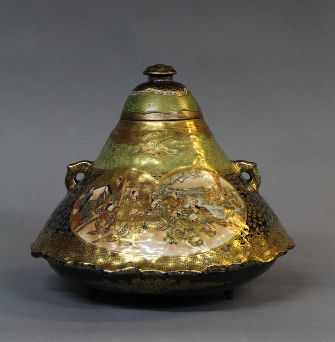 A large Japanese 19th century mount Fuji shaped Satsuma vase and cover