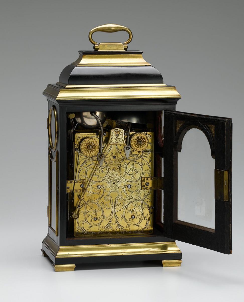 John Everell, London A fine Geo III brass bound ebony veneered table clock of small size