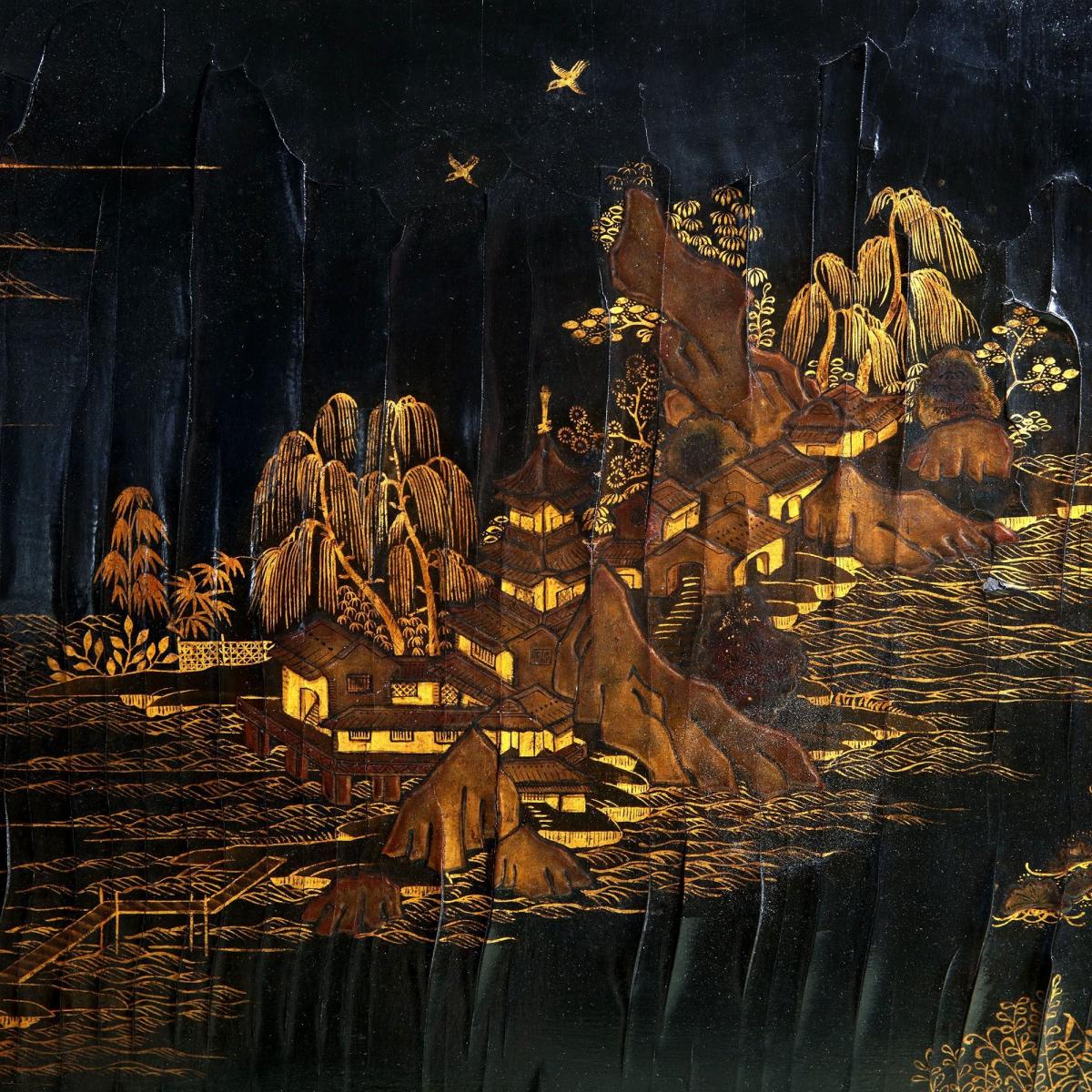 A low table with a 19th century Chinese lacquer panel