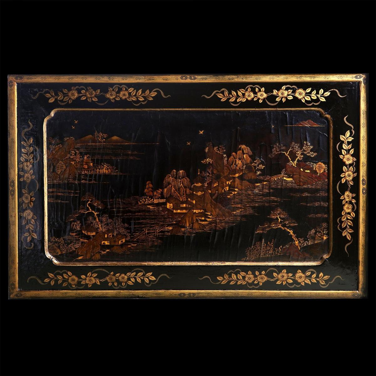 A low table with a 19th century Chinese lacquer panel