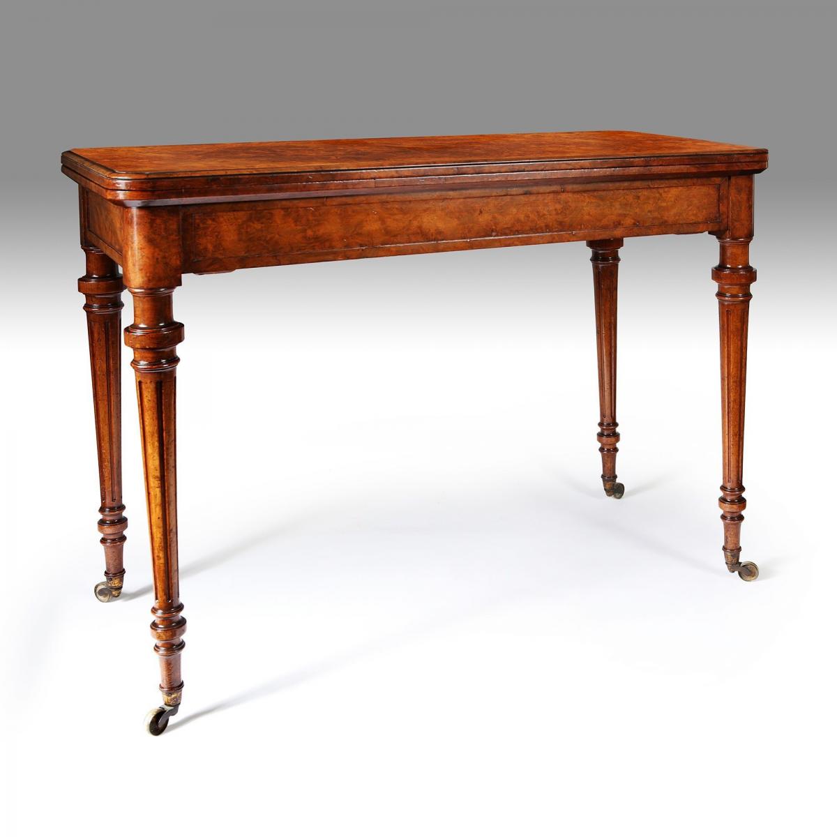 A mid 19th century burr walnut card table