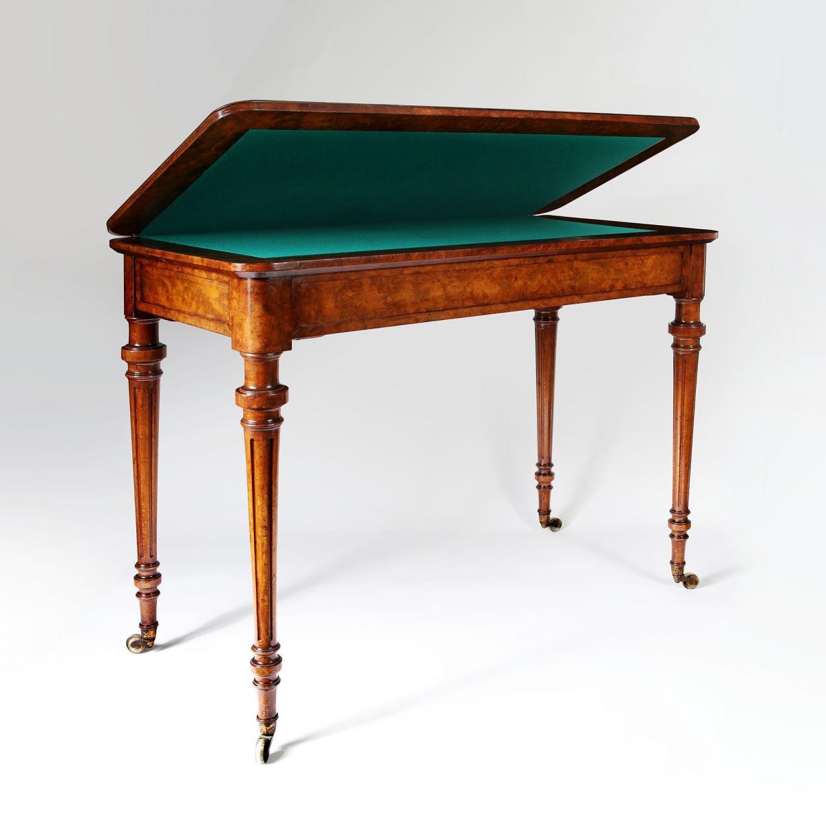 A mid 19th century burr walnut card table