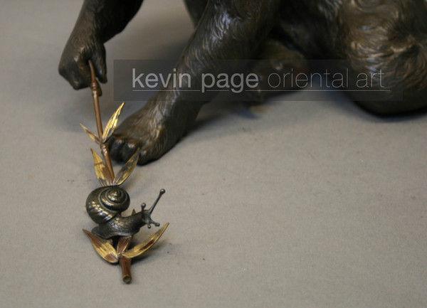 A charming bronze of a monkey and a snail