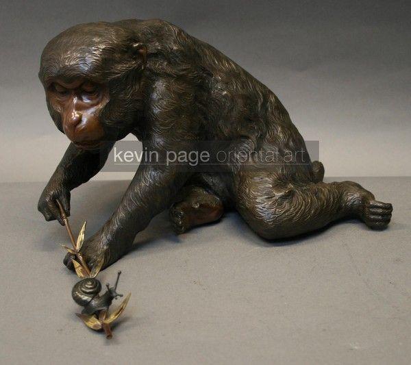 A charming bronze of a monkey and a snail