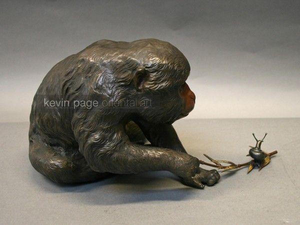 A charming bronze of a monkey and a snail