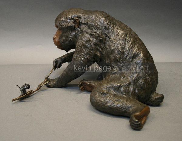 A charming bronze of a monkey and a snail