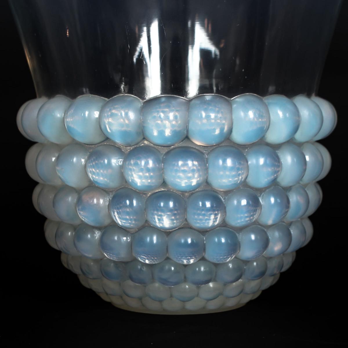 Graines, an Art Deco opalescent glass vase with a raised motif of blossoms. Literature: Marcilhac, R Lalique Catalogue Raisonné