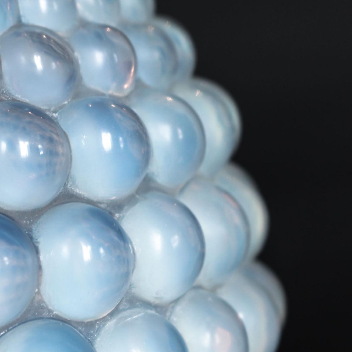 Graines, an Art Deco opalescent glass vase with a raised motif of blossoms. Literature: Marcilhac, R Lalique Catalogue Raisonné