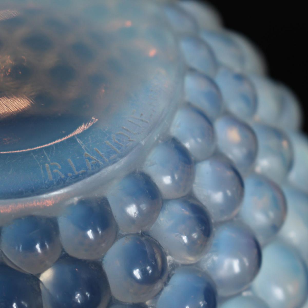 Graines, an Art Deco opalescent glass vase with a raised motif of blossoms. Literature: Marcilhac, R Lalique Catalogue Raisonné