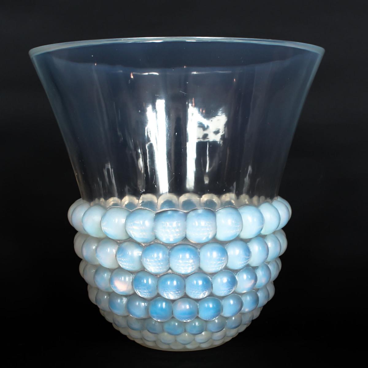 Graines, an Art Deco opalescent glass vase with a raised motif of blossoms. Literature: Marcilhac, R Lalique Catalogue Raisonné