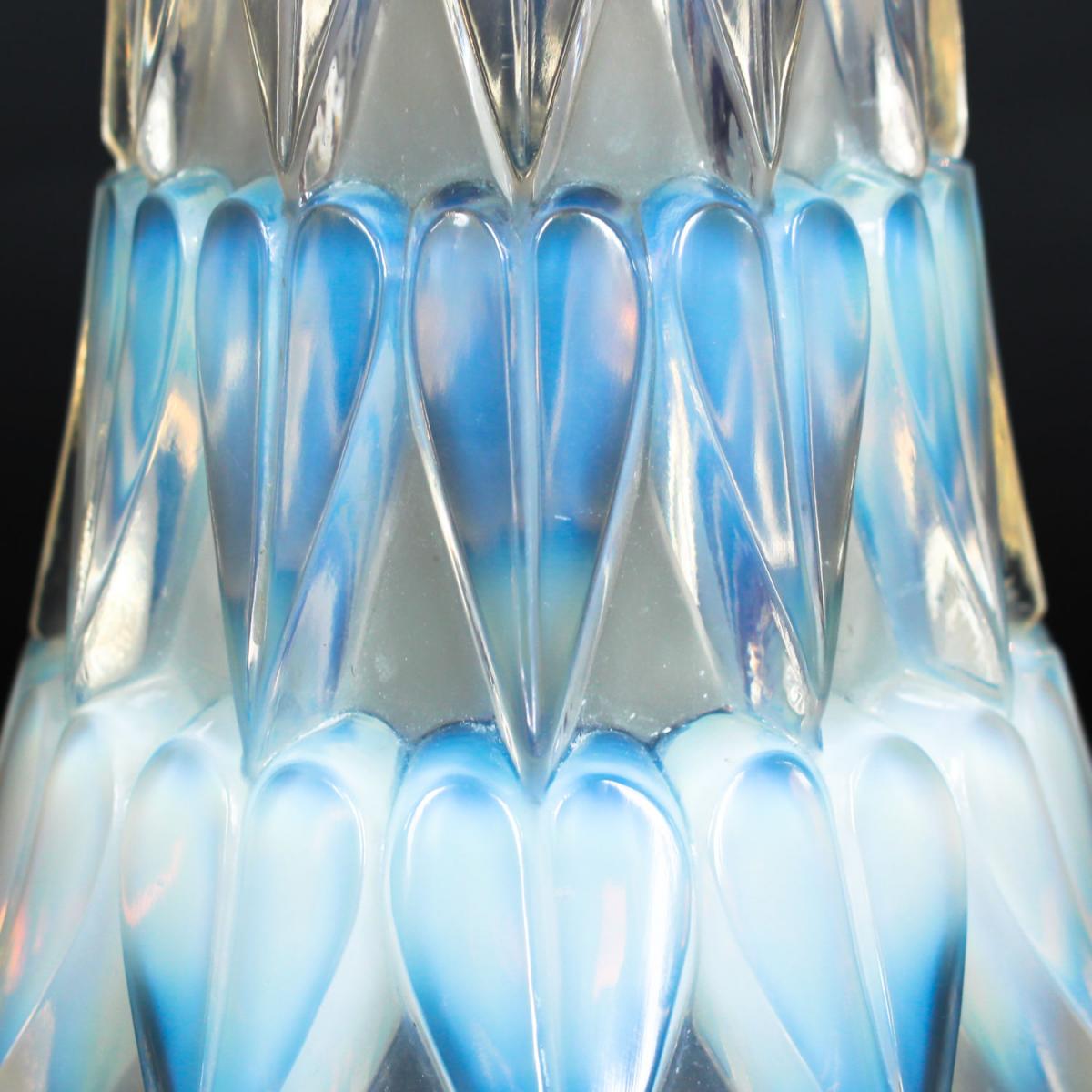 Feuilles, an Art Deco opalescent and moulded glass vase by René Lalique. Relief decorated with raised hearts. Stencil etched R