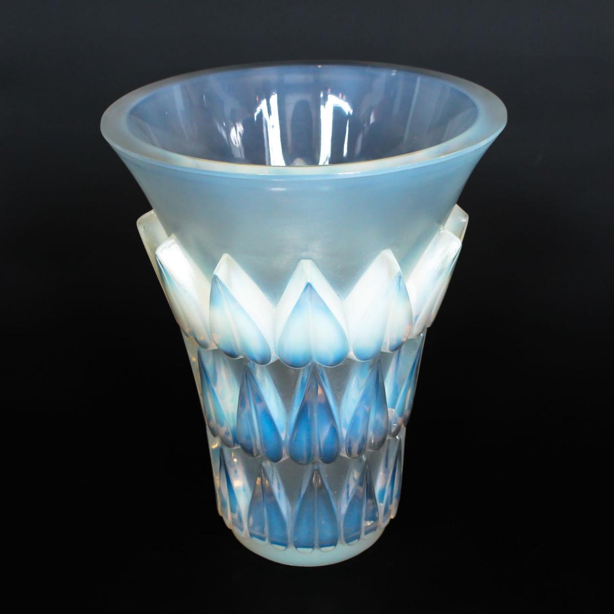 Feuilles, an Art Deco opalescent and moulded glass vase by René Lalique. Relief decorated with raised hearts. Stencil etched R