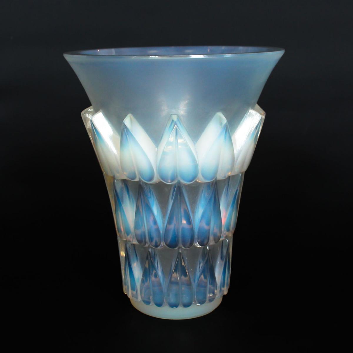 Feuilles, an Art Deco opalescent and moulded glass vase by René Lalique. Relief decorated with raised hearts. Stencil etched R
