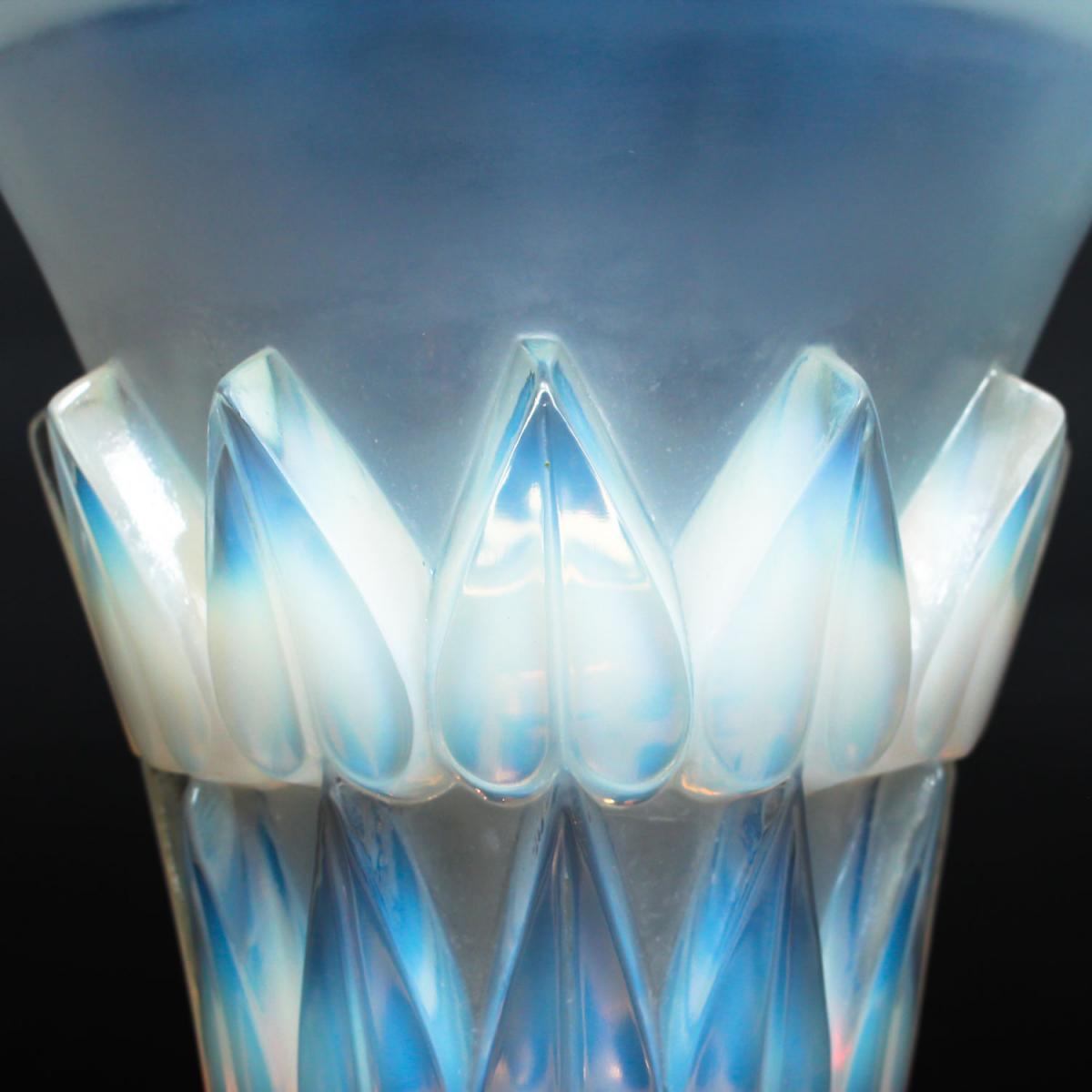 Feuilles, an Art Deco opalescent and moulded glass vase by René Lalique. Relief decorated with raised hearts. Stencil etched R