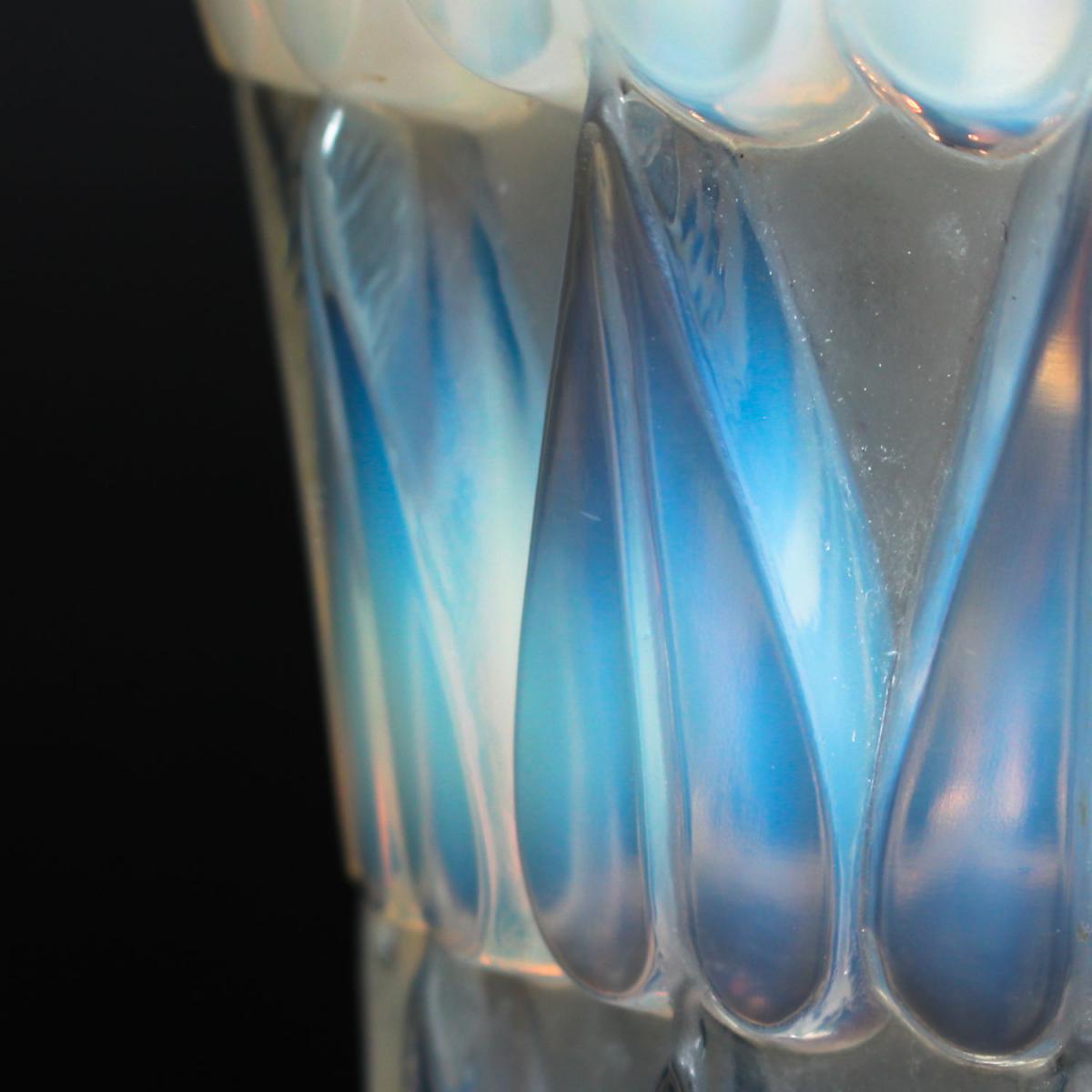 Feuilles, an Art Deco opalescent and moulded glass vase by René Lalique. Relief decorated with raised hearts. Stencil etched R