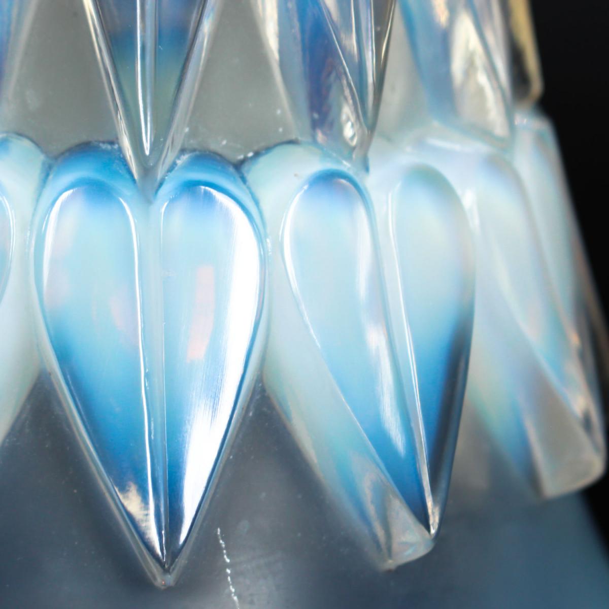 Feuilles, an Art Deco opalescent and moulded glass vase by René Lalique. Relief decorated with raised hearts. Stencil etched R