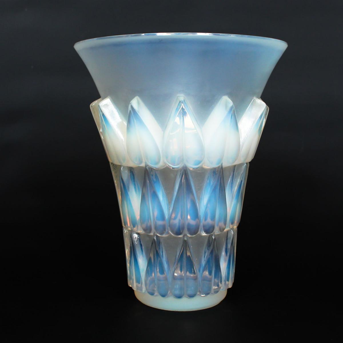 Feuilles, an Art Deco opalescent and moulded glass vase by René Lalique. Relief decorated with raised hearts. Stencil etched R