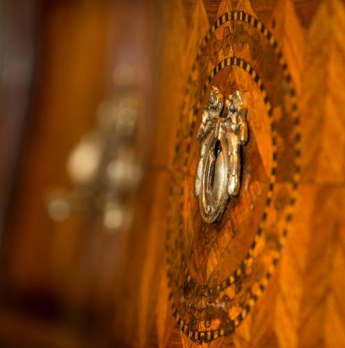 Detail of an antique furniture regency cabinet