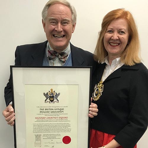 Richard Courtney recieves the BADA distinguished service award from BADA President Victoria Borwick
