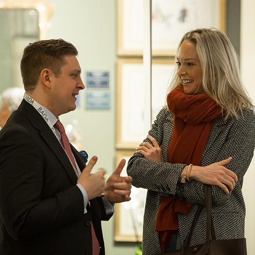 A bada dealer providing information and advice to a client