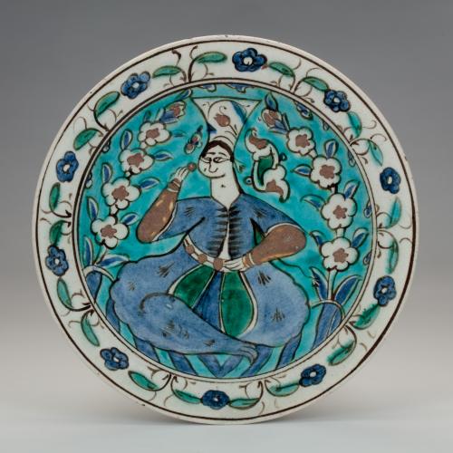 Iznik dish with a figure of a woman, first half of the 17th century, Turkey